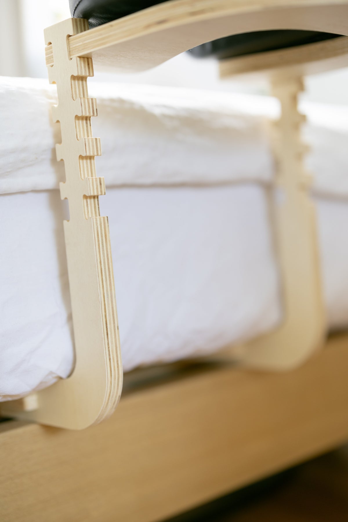 The assembled wooden frame on a white bed