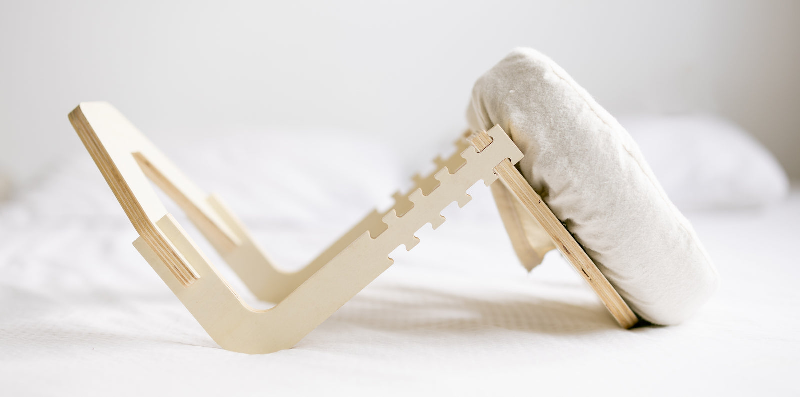 The Ezspa Bed Massage Set set up on a made bed