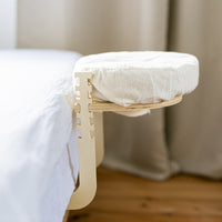 The Ezspa Bed Massage Set set up at the edge of a made bed
