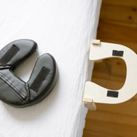 The head cushion in vegan PU leather with the velcro strips and the support plate